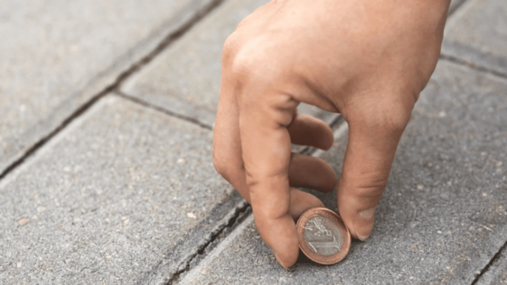 Warning: The Real Risks Of Picking Up Money From The Ground According To A Legal Expert