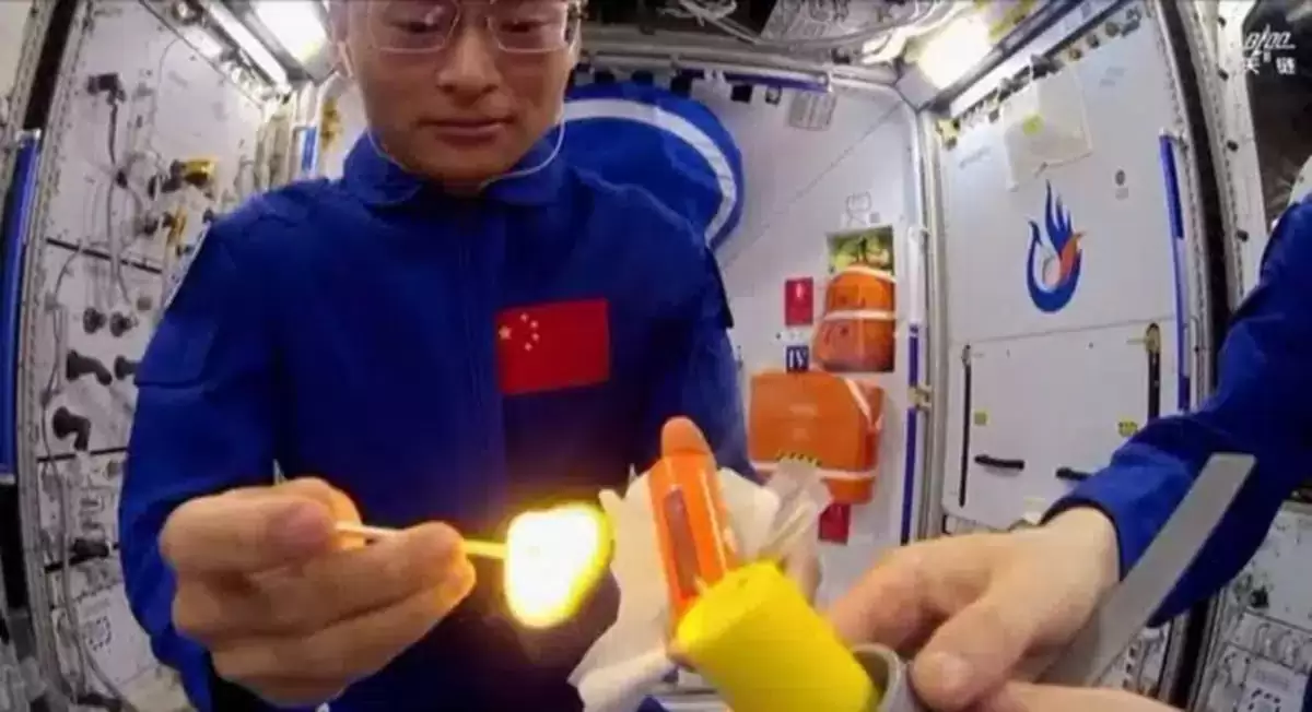 Video Chinese Astronauts Strike A Match Aboard Their Station